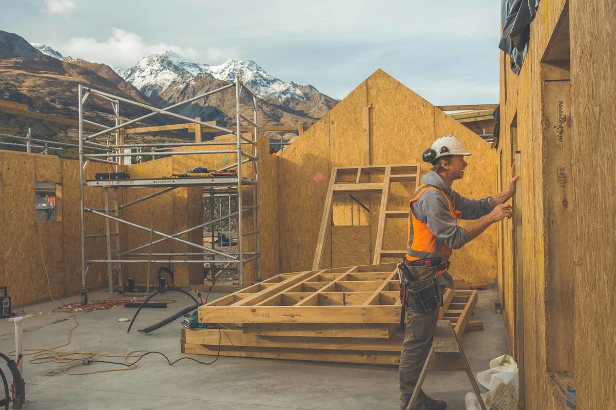 Camp Glenorchy cabin interior with SIP panels bldr mountain backdrop low